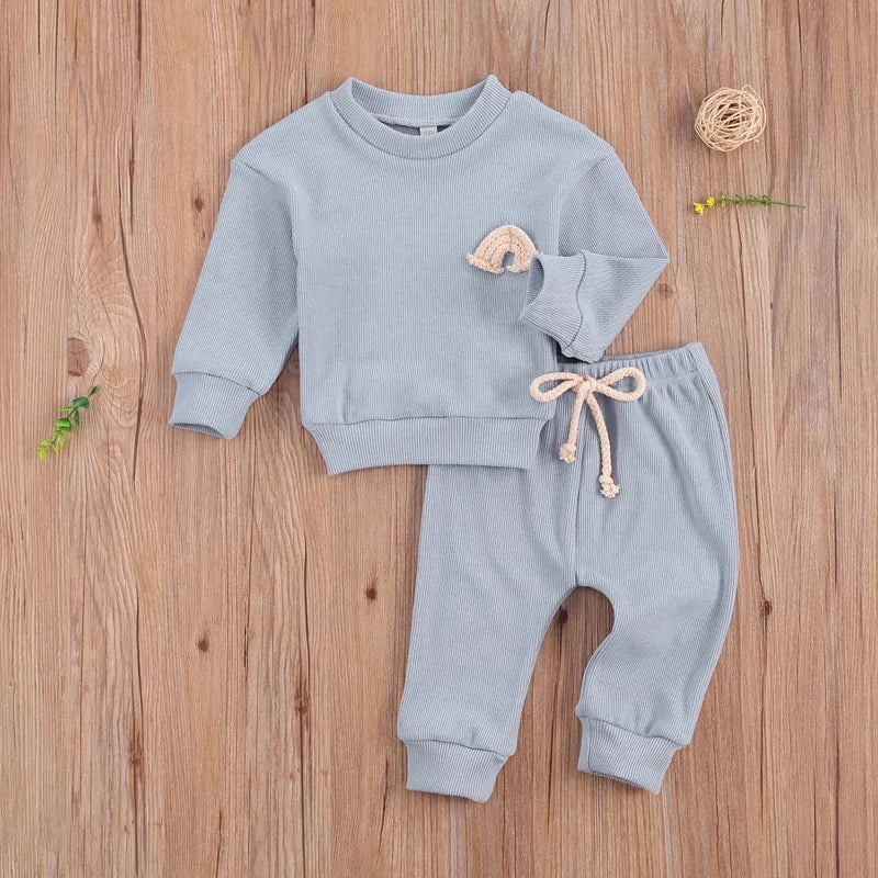 Two-piece baby outfit with rainbow print, ideal for spring in Canada