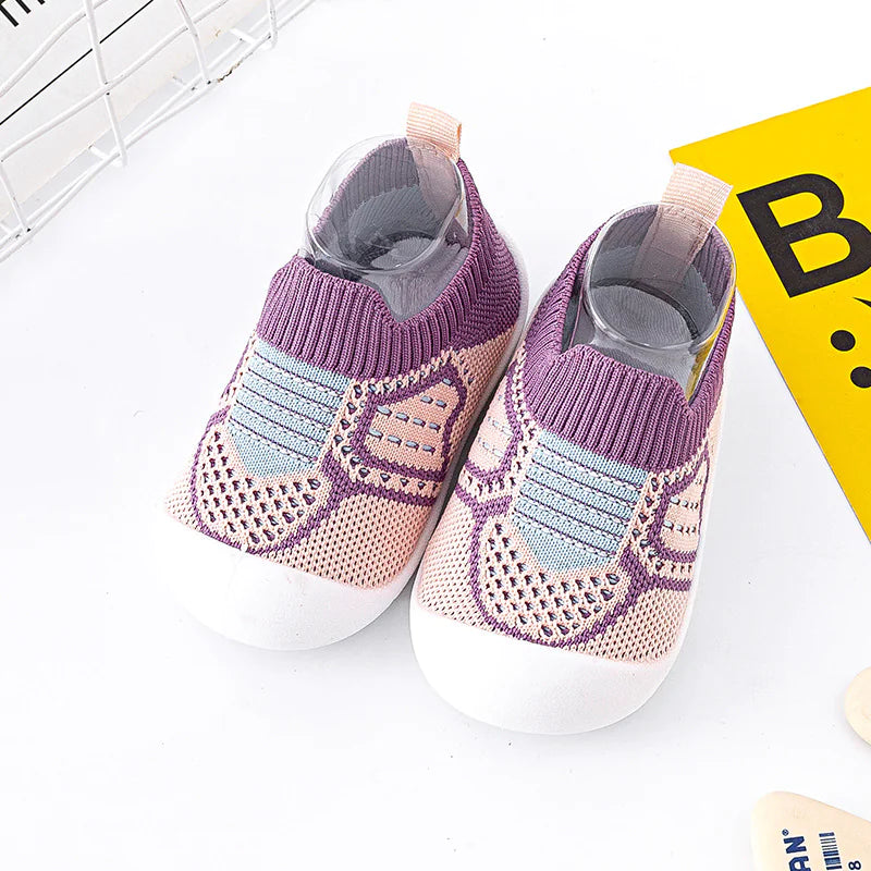 Infant StepSecure Flexible Shoes for toddlers with non-slip soles, lightweight construction, and comfortable fit, designed to support first steps and promote healthy foot development for both boys and girls.