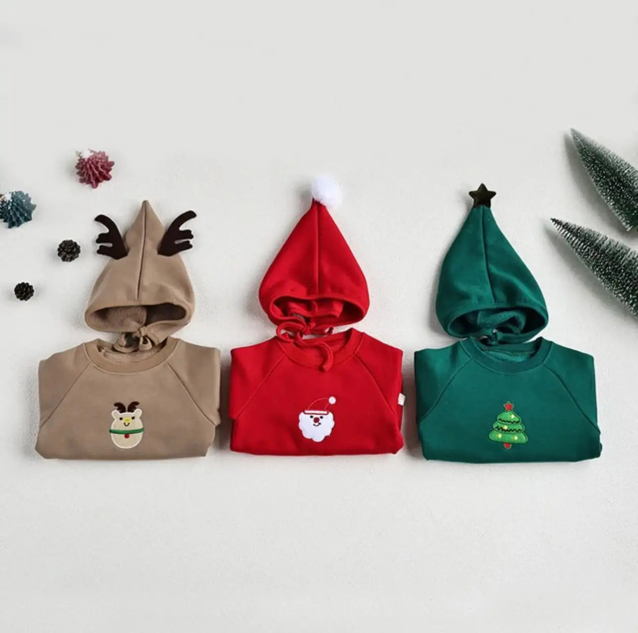 Baby wearing green Santa Claus romper – adorable holiday clothing for infants in Canada and USA