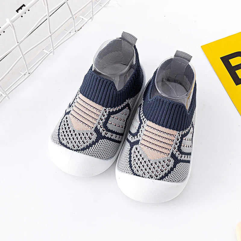Infant StepSecure Flexible Shoes for toddlers with non-slip soles, lightweight construction, and comfortable fit, designed to support first steps and promote healthy foot development for both boys and girls.
