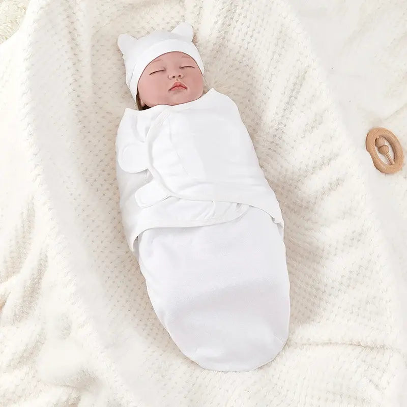Cotton swaddle blanket with hat for newborns, promoting comfort and sleep in the USA.